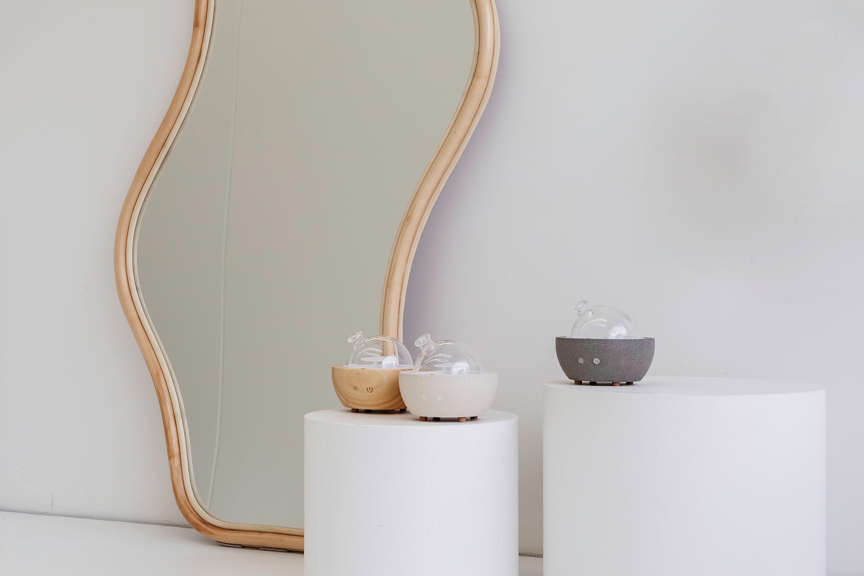 Beautiful essential oil diffusers in white, wood and concrete finishes